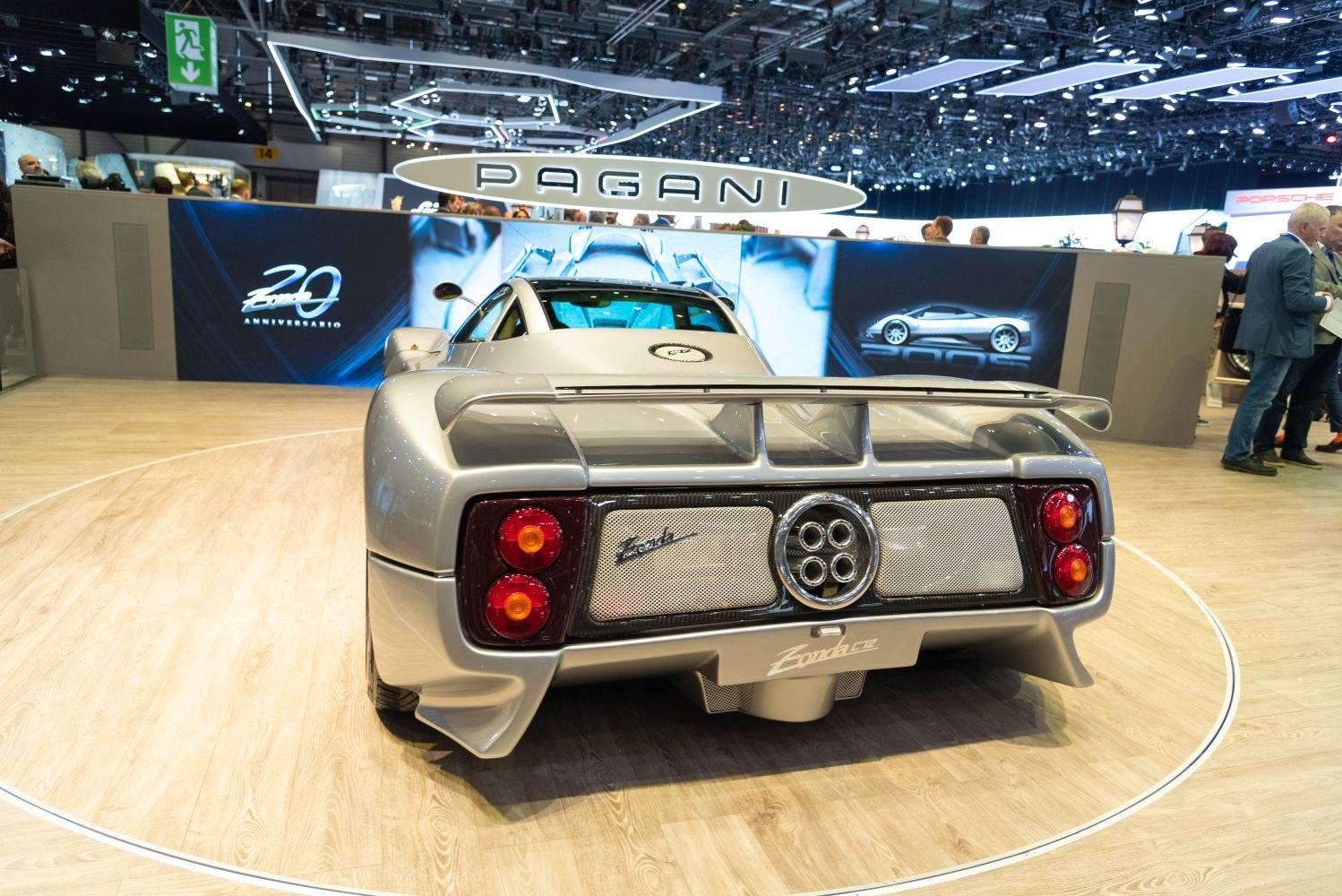 Rear view with quad exhaust pipes, round taillights, and large rear wing