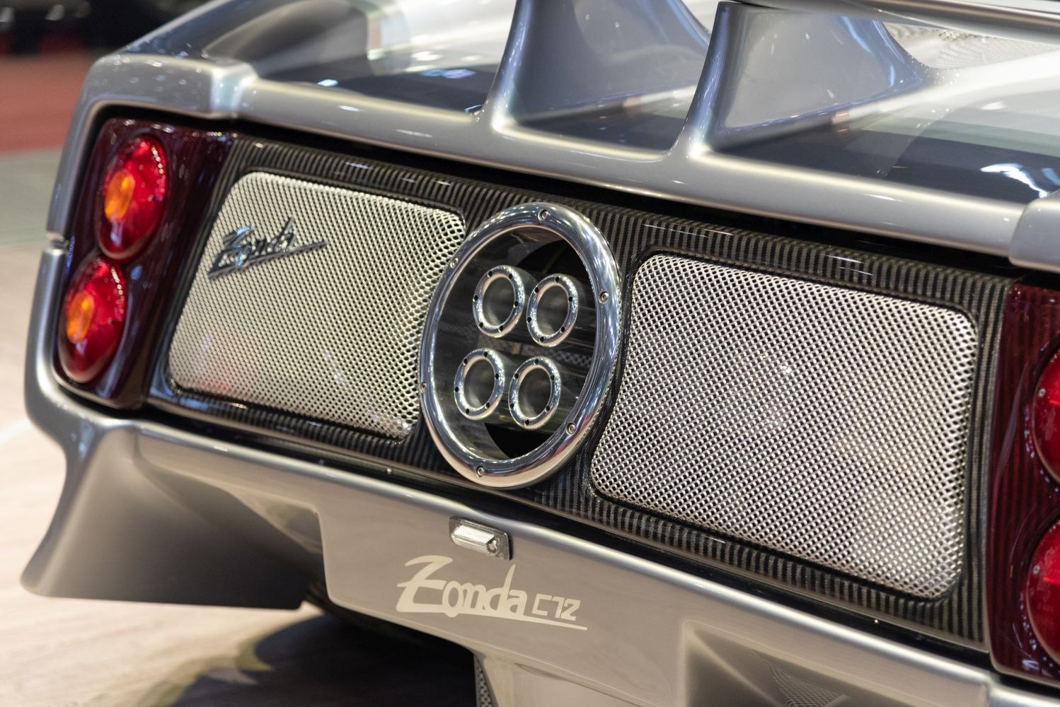 Quad exhaust pipes and rear mesh paneling with taillights