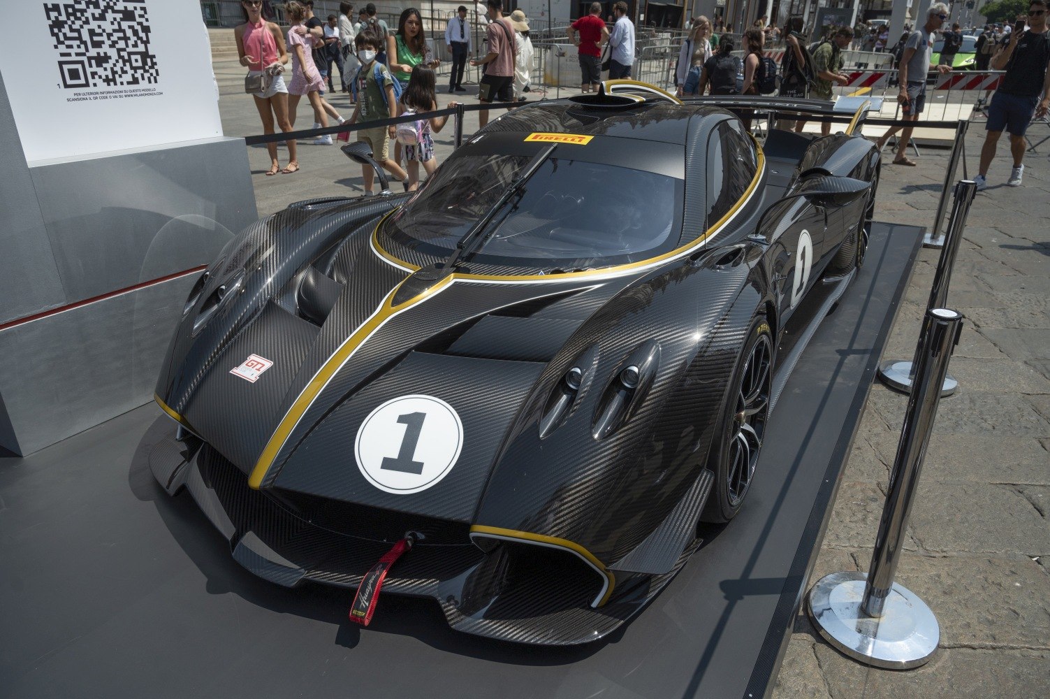 Carbon fiber hypercar with aerodynamic features and racing design.
