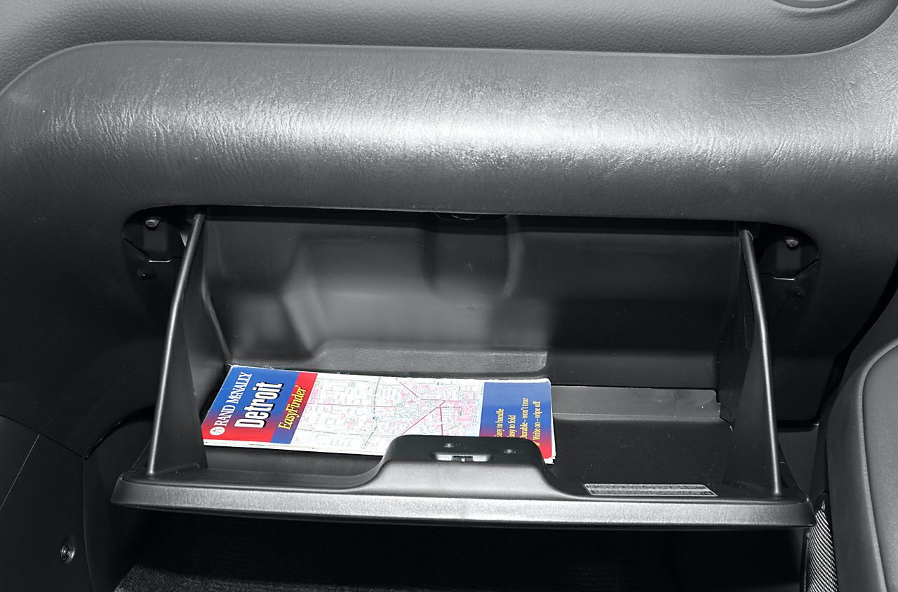 Open glove compartment with map inside