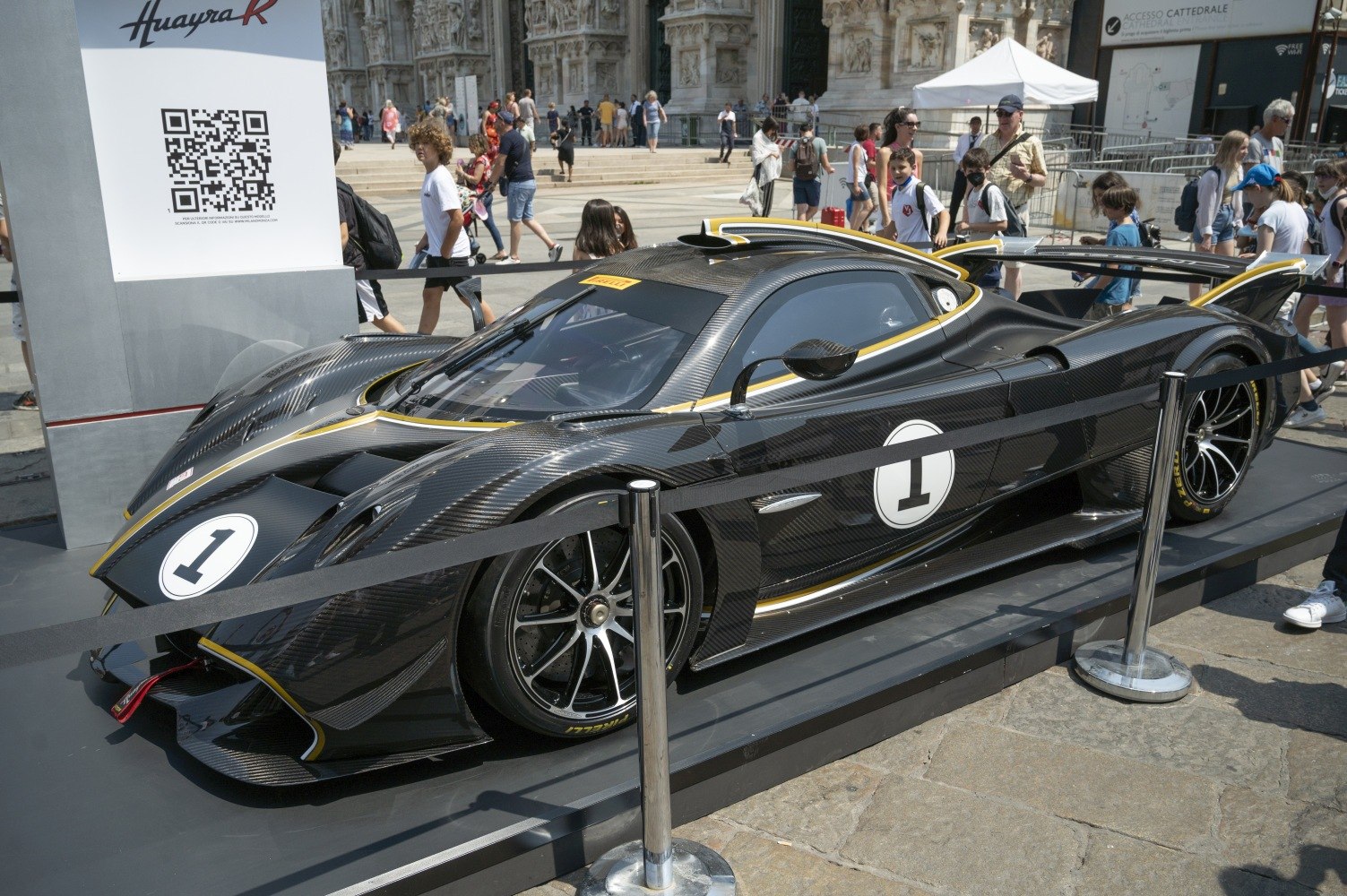 Sleek carbon fiber body with aerodynamic racing design and large rear wing