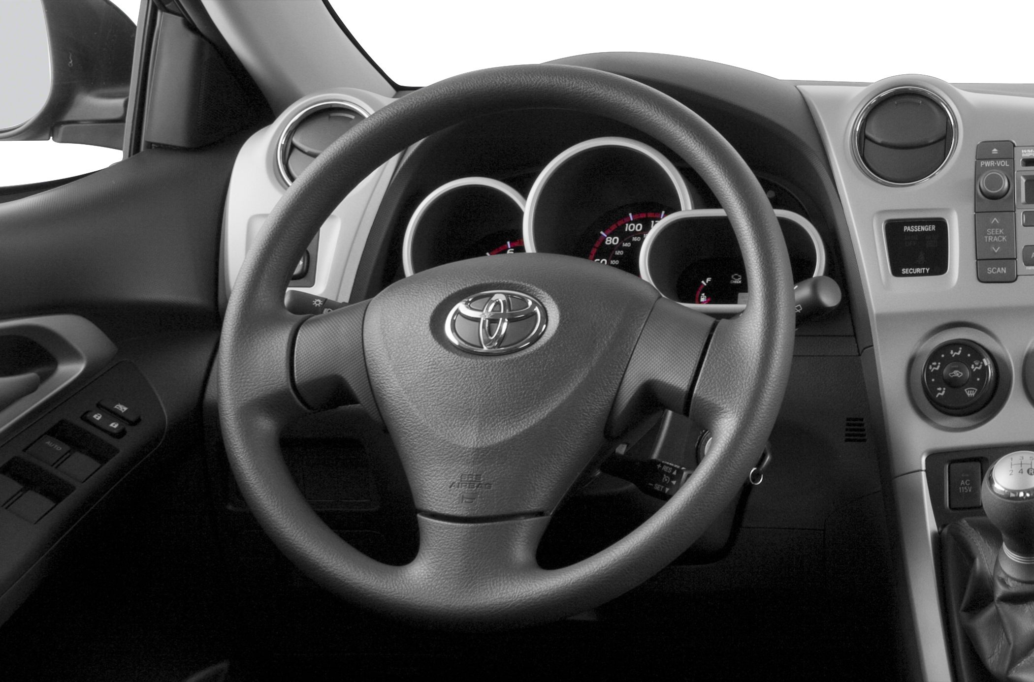 Steering wheel and dashboard with instrument cluster in car interior