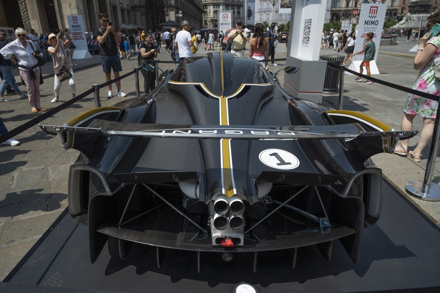 Rear aerodynamic design with quad exhausts and racing wing