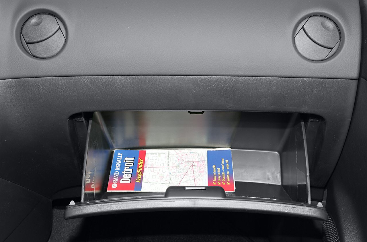 Open glove compartment with a map inside