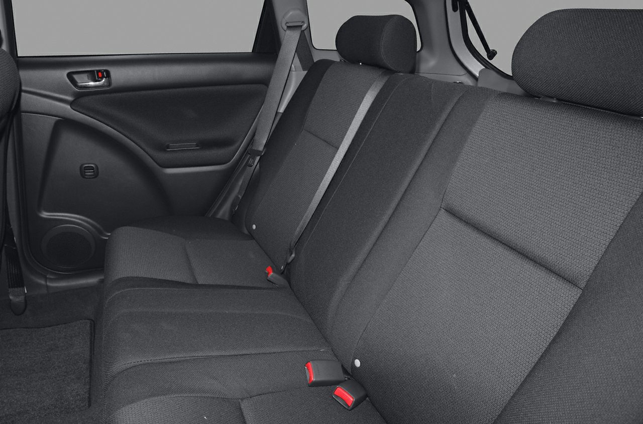 Rear seat with fabric upholstery and seatbelt setup