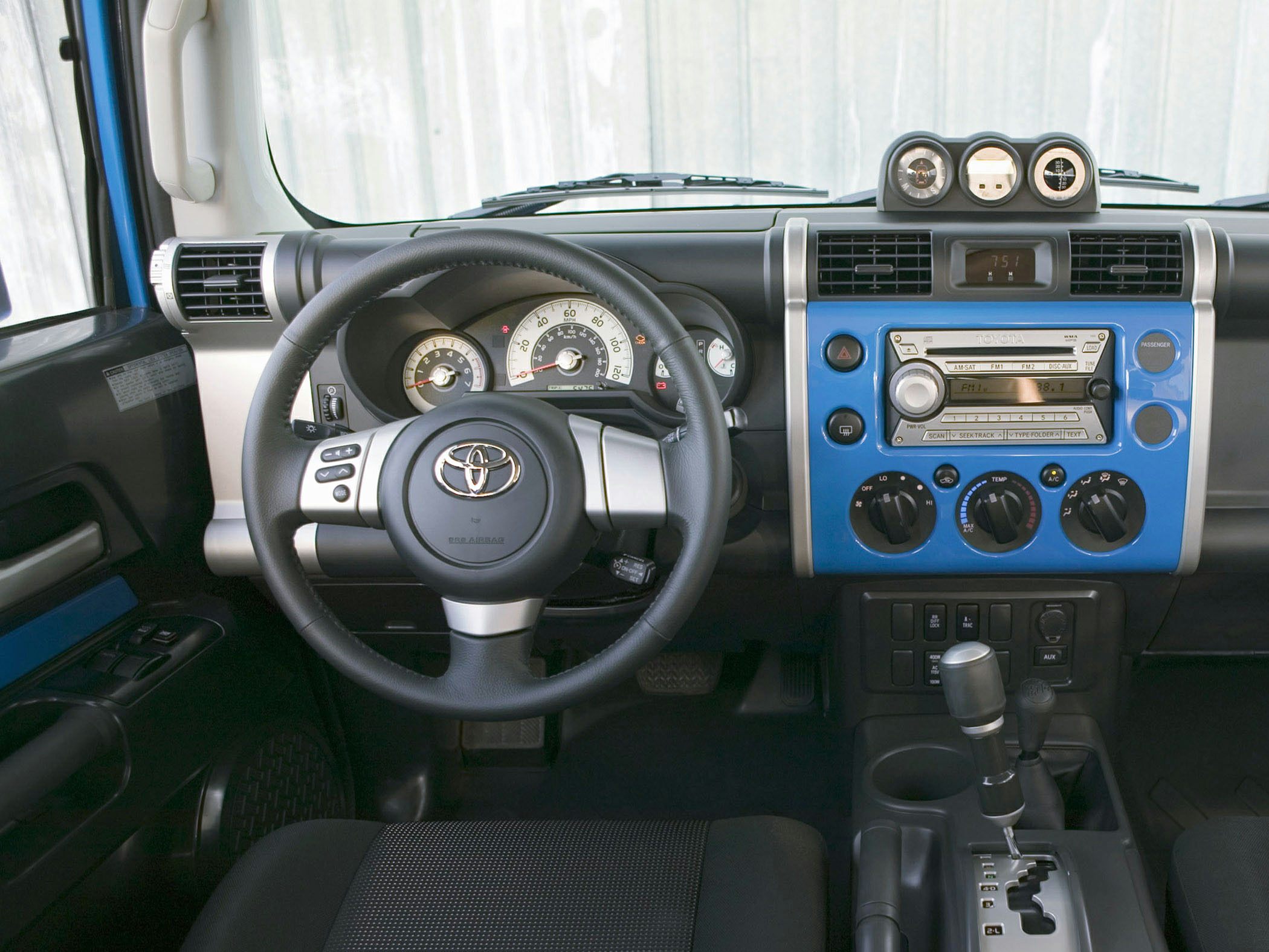 Dashboard and steering wheel with instrument cluster and climate controls