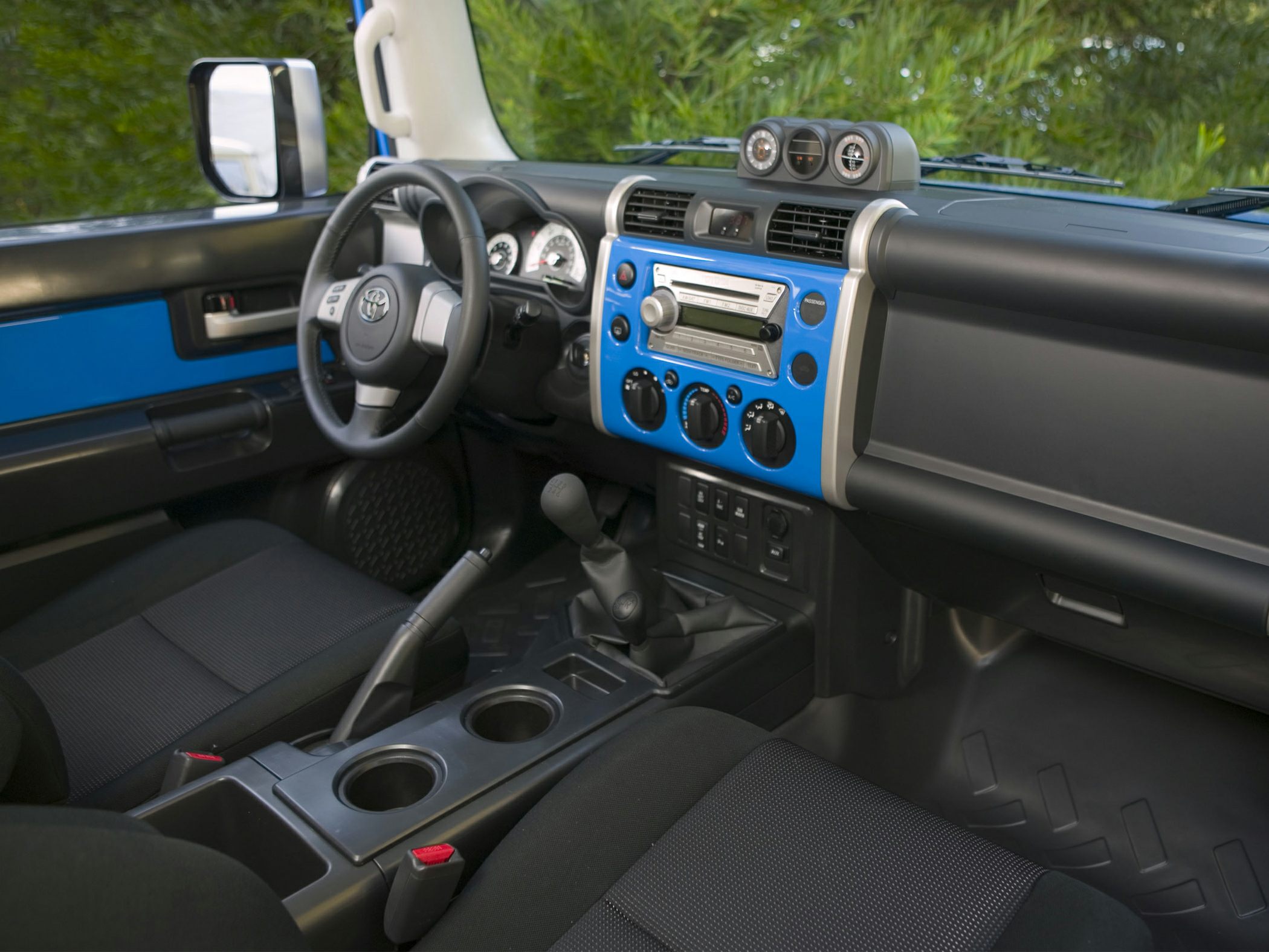 Interior dashboard with manual gear shift and control panel