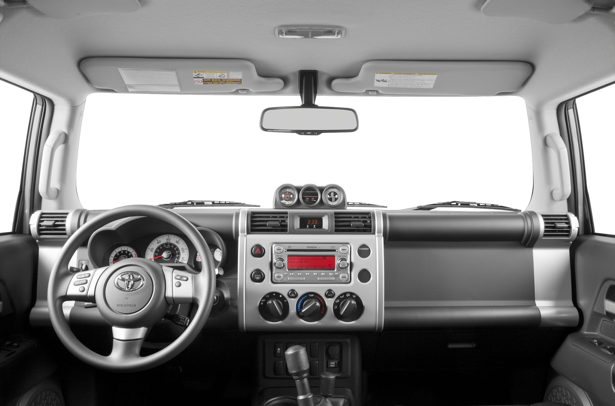 Dashboard and steering wheel with central gauges and radio controls