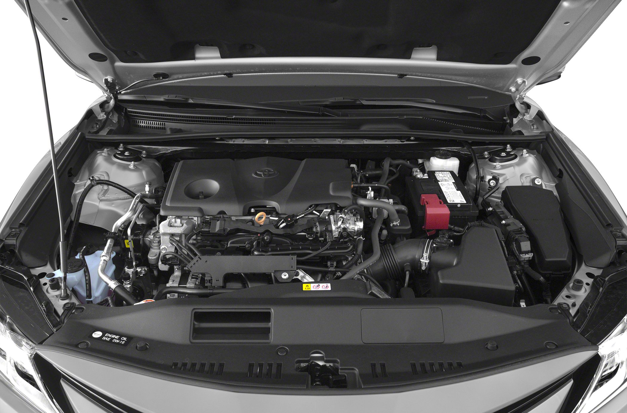 Engine bay layout with visible engine components and battery