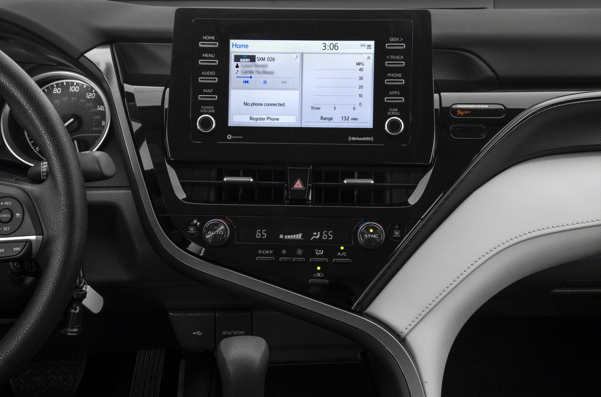 Modern dashboard with touchscreen display and dual-zone climate control.