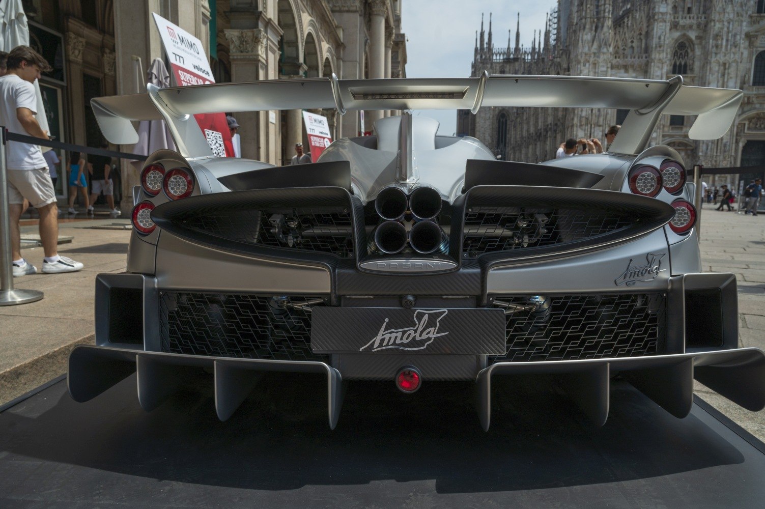 Quad exhaust and fixed rear wing on hypercar.