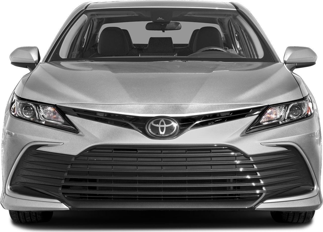 Front view of car with grille and sharp headlights