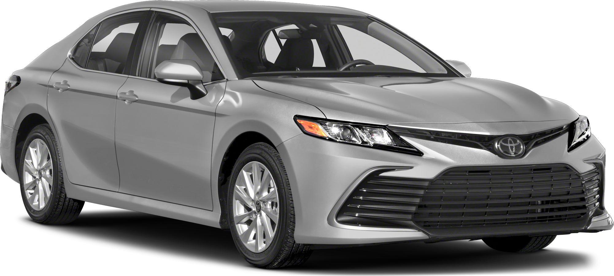 Front angled view with sleek headlights and large black grille