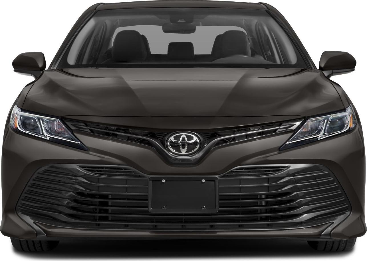 Front view with sleek headlights and wide grille