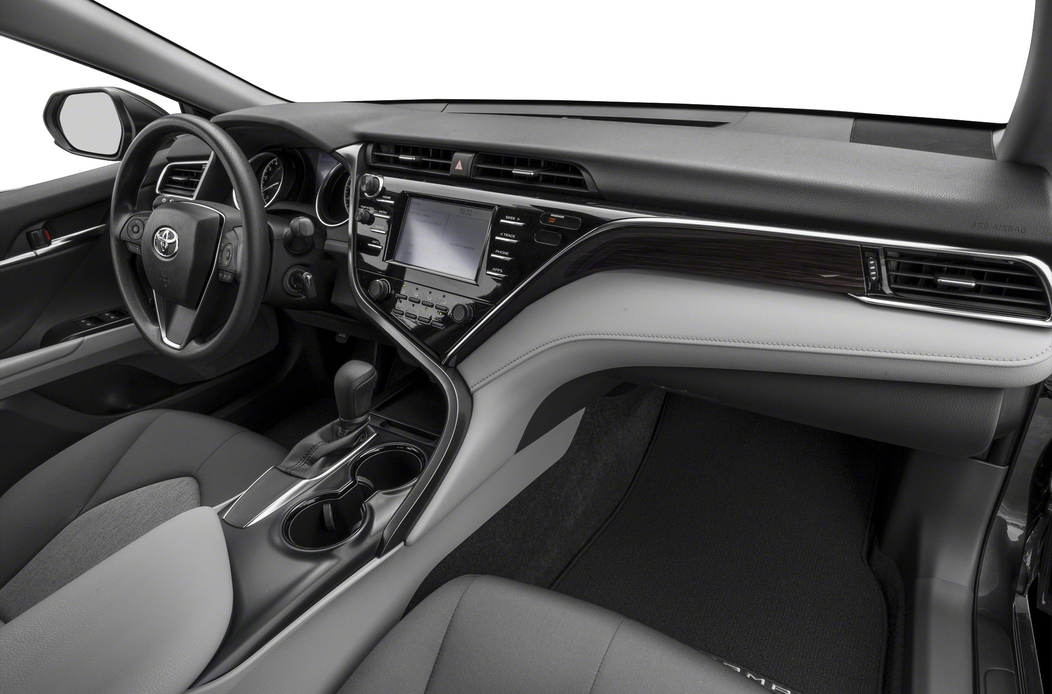 Dashboard with touchscreen, steering wheel, and center console with gear shift