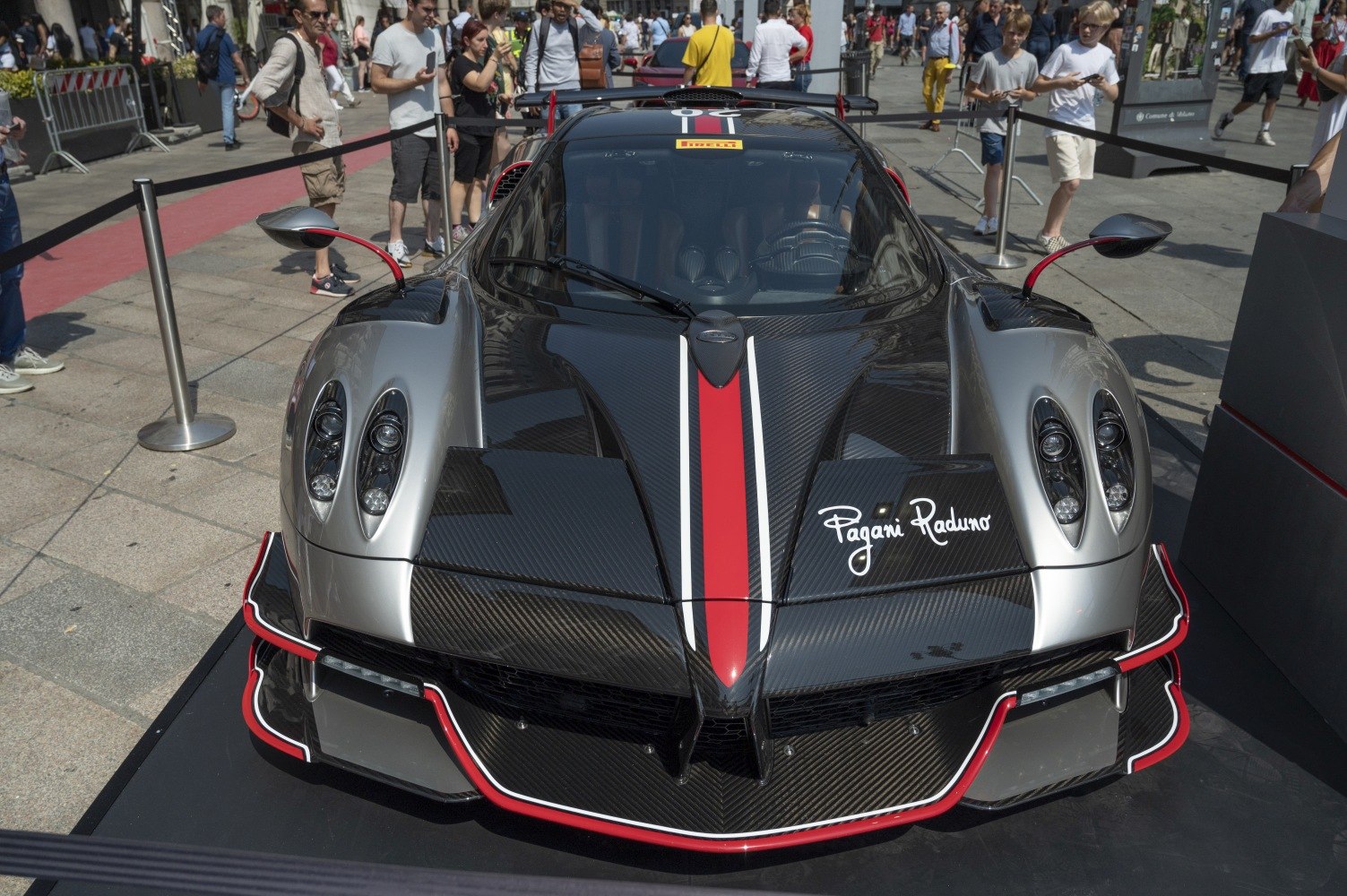 Carbon fiber front with red racing stripe and quad headlights.