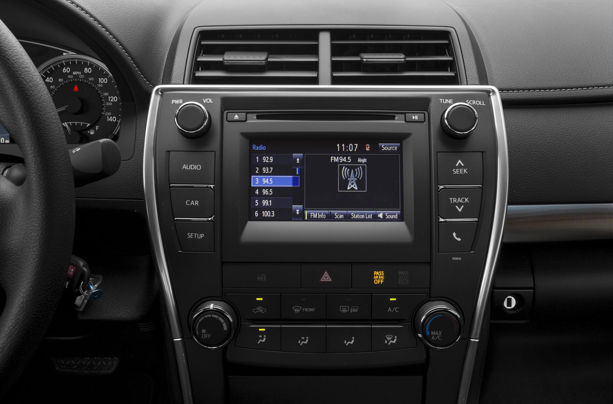 Car infotainment touchscreen with control knobs and climate buttons