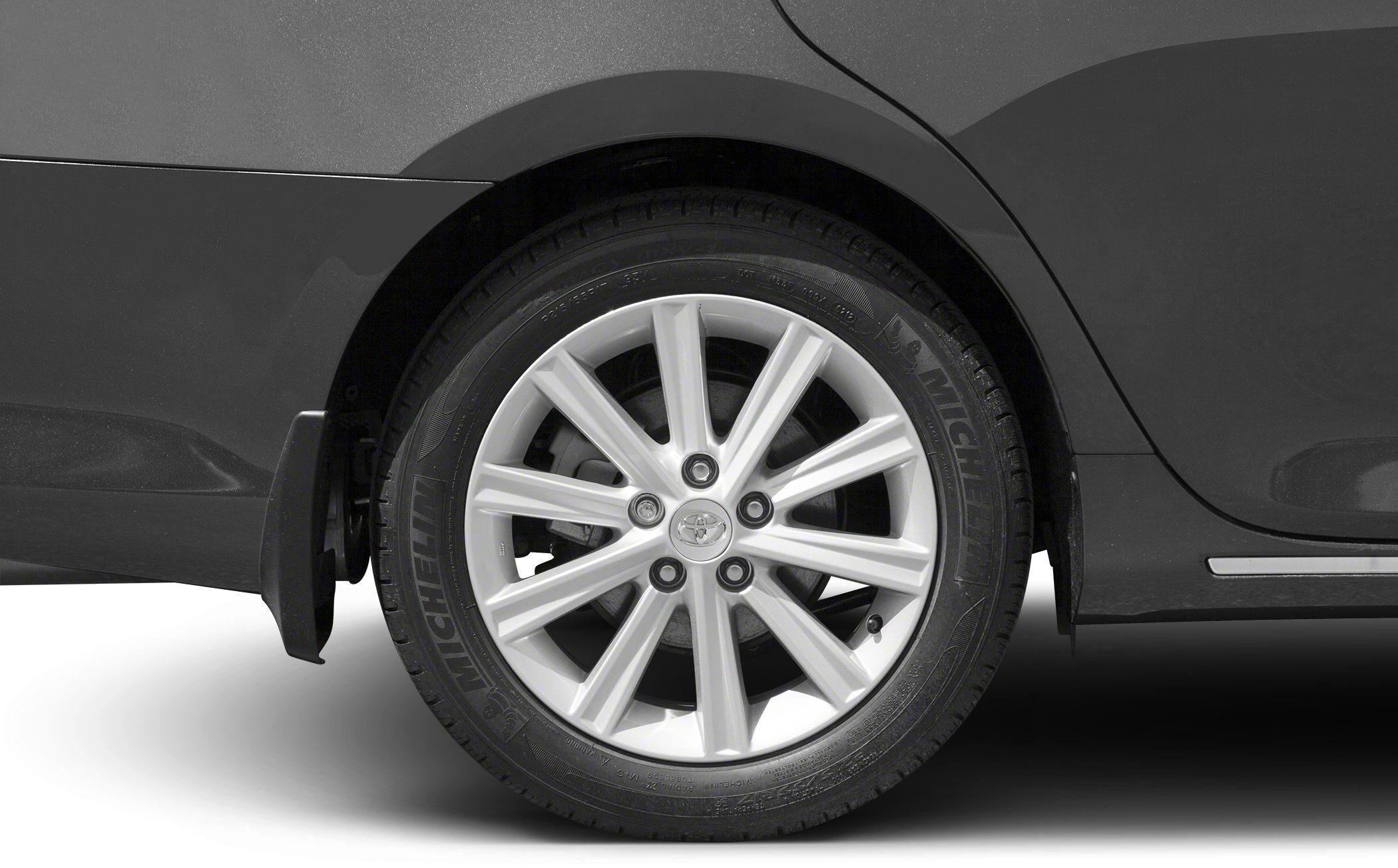 Close-up of multi-spoke alloy wheel with Michelin tire on rear side