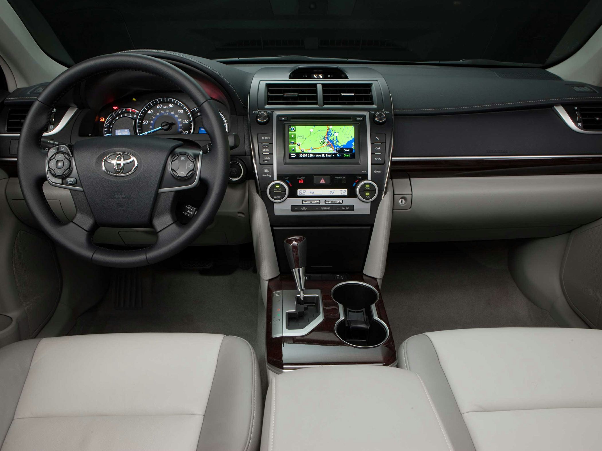 Dashboard and steering wheel with navigation screen and climate controls