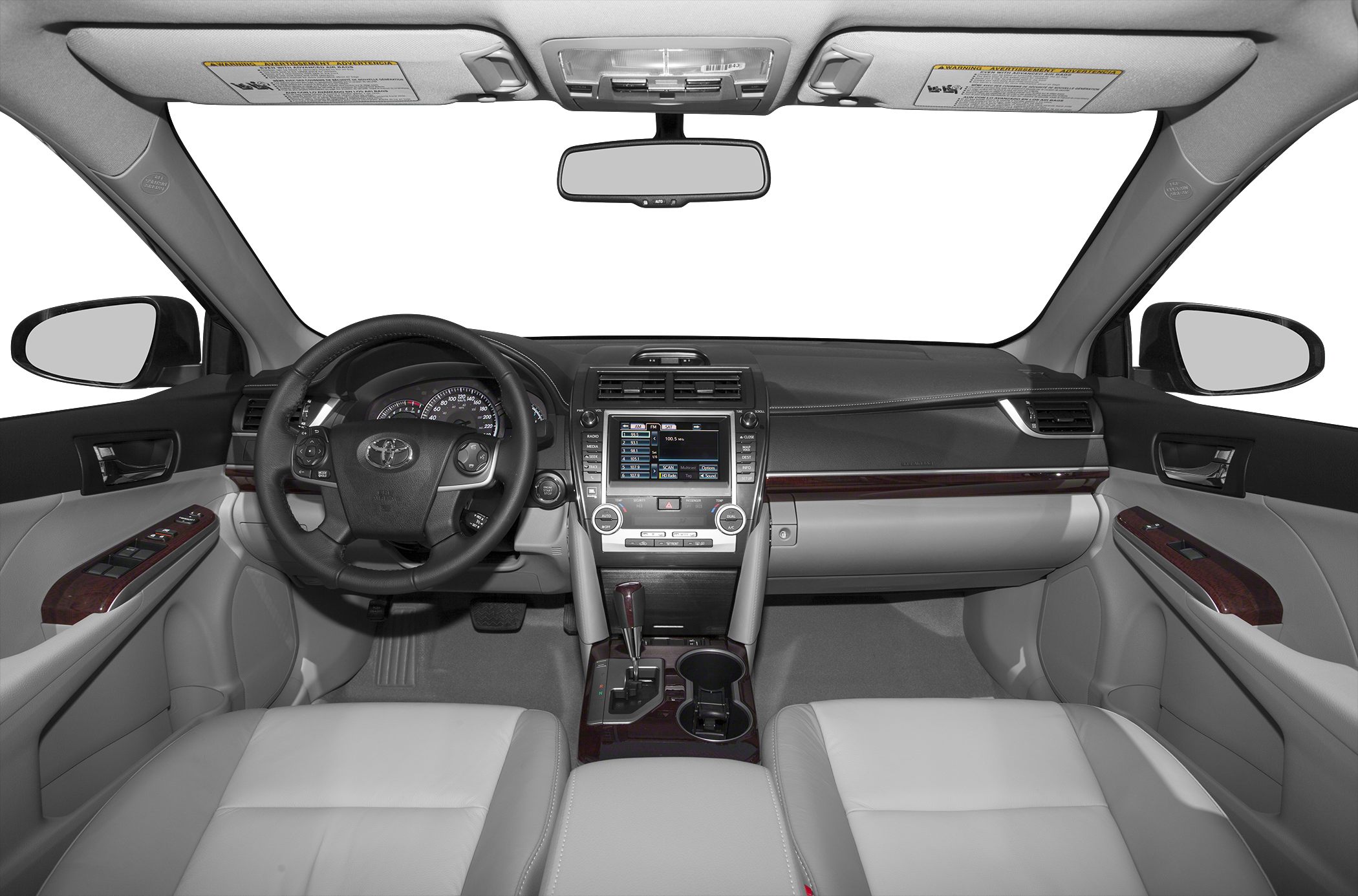 Dashboard, steering wheel, and front cabin interior with wood trim and automatic gear shift.