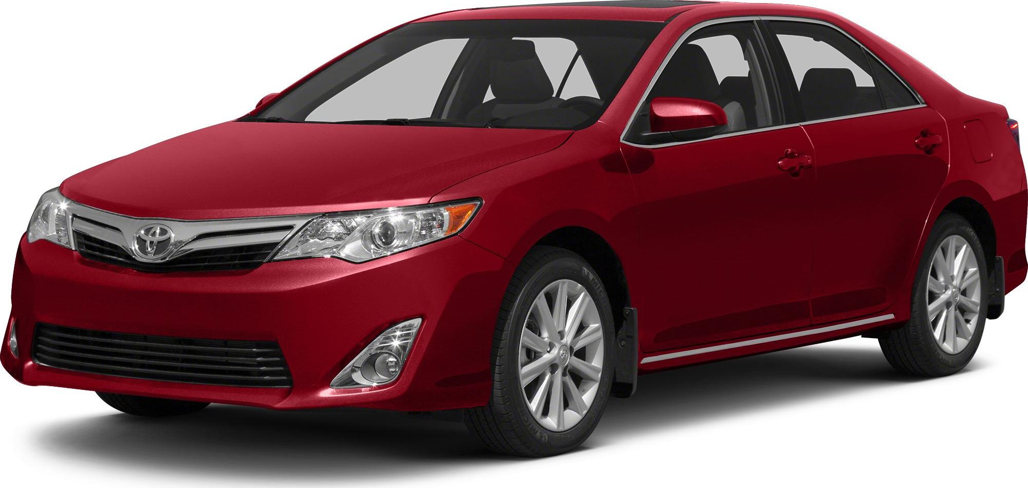 Red sedan with front grille, headlight, and alloy wheels side profile