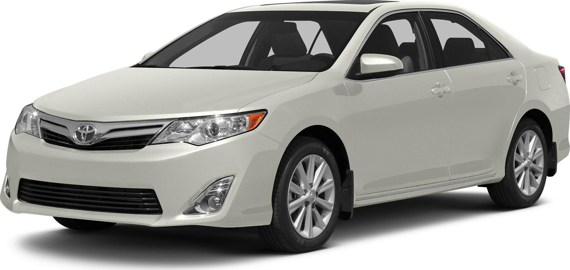 Front view of white mid-size sedan with modern headlights and aerodynamic shape