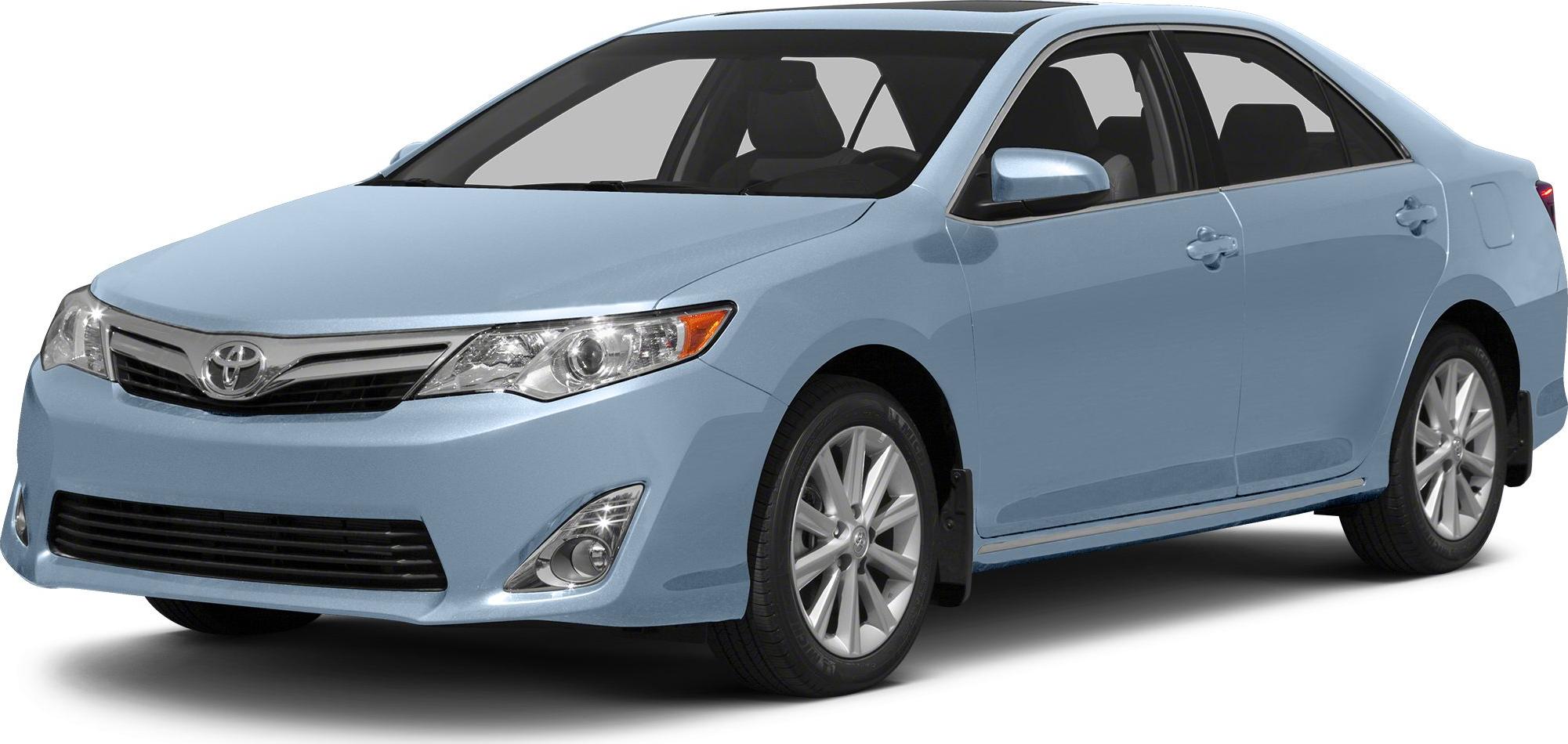 Front-side view of a light blue sedan with detailed headlamps and alloy wheels