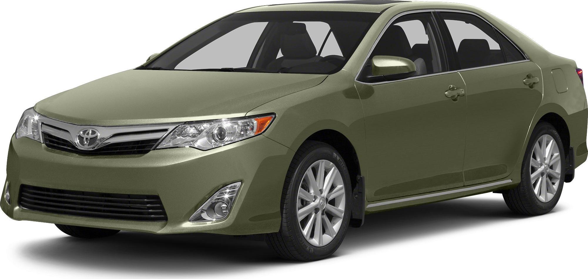 Green sedan front side view with alloy wheels and chrome grille