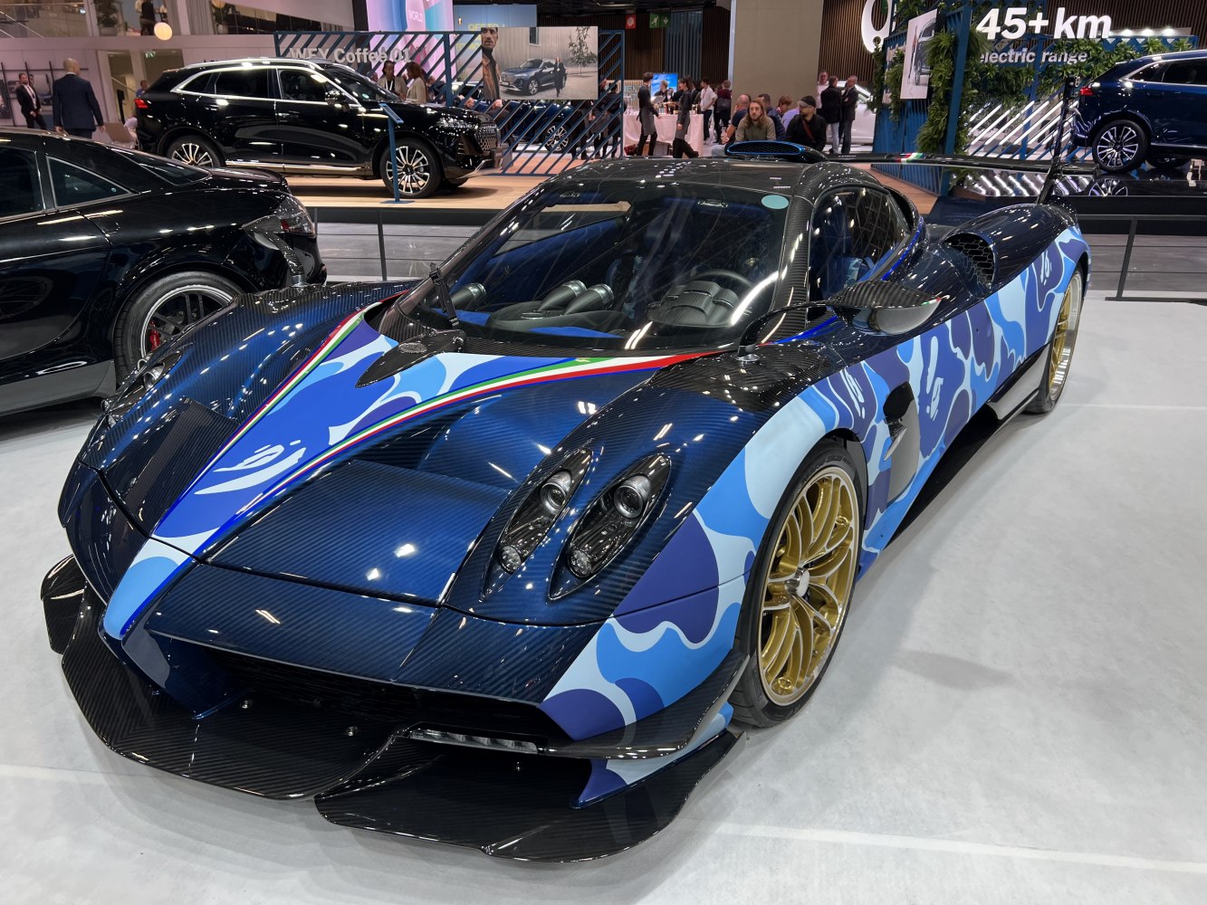 Carbon fiber body with blue camouflage and aerodynamic design elements