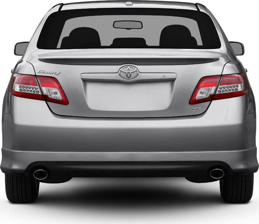 Rear view of a sedan showing taillights, trunk, and dual exhaust pipes