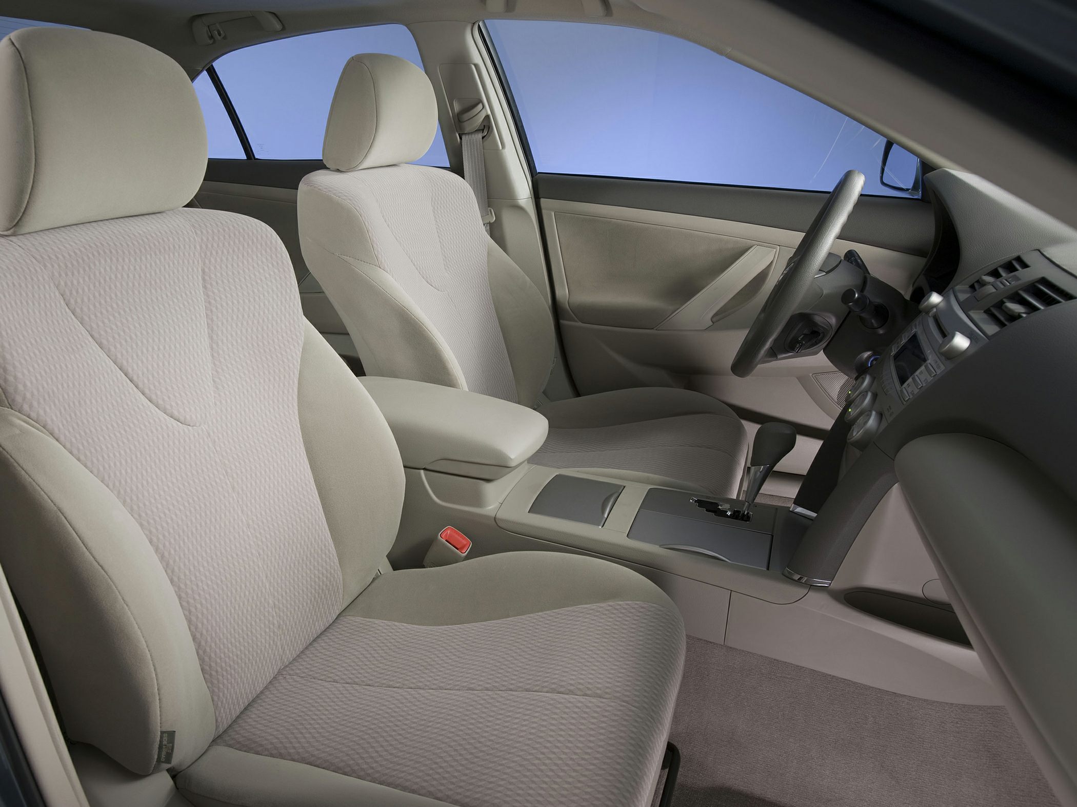 Beige fabric front seats and dashboard with automatic gear shift