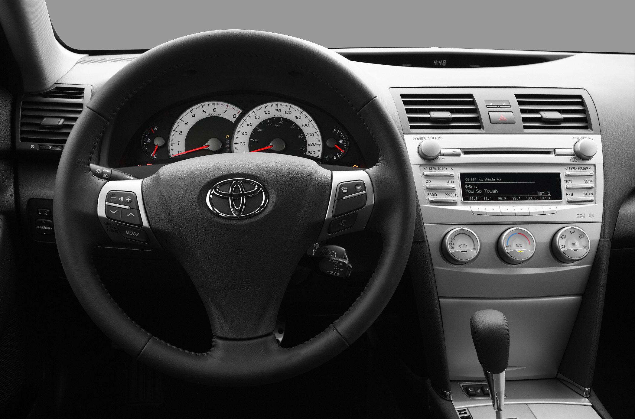 Steering wheel, dashboard, and center control panel of a mid-size sedan