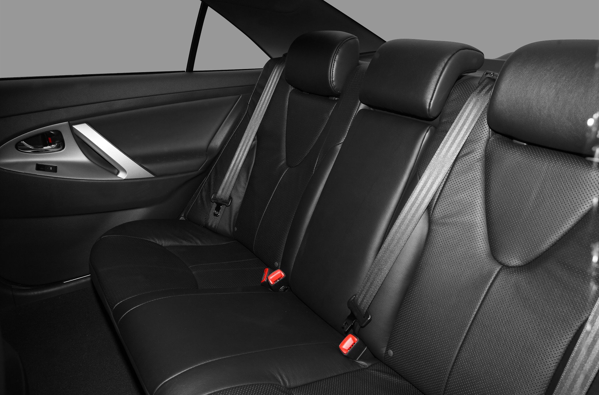 Black leather rear seats with headrests and seatbelts