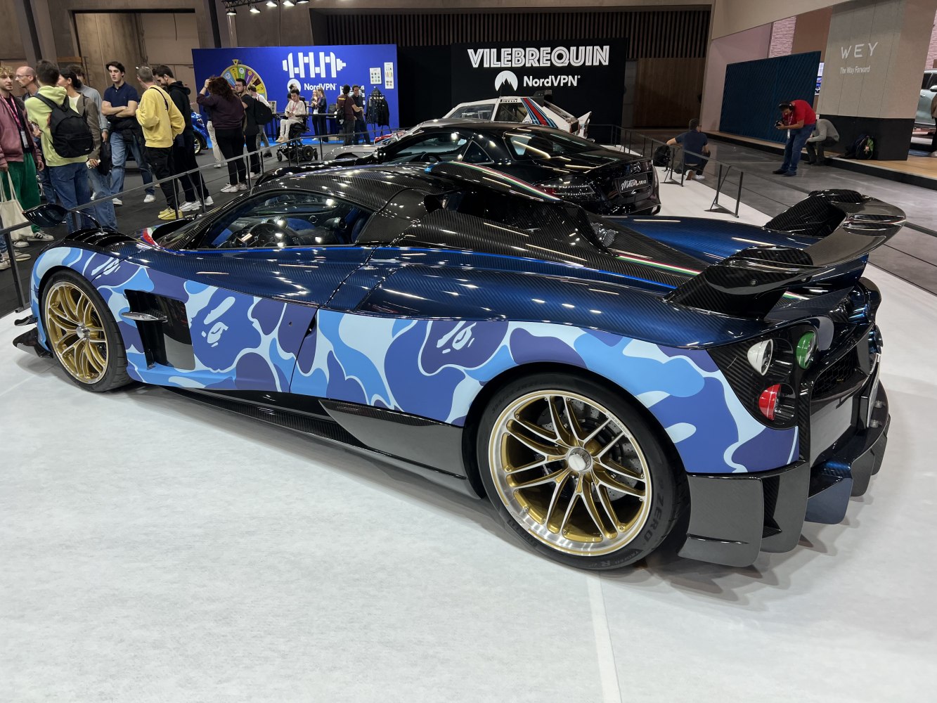 Carbon fiber rear wing and blue camouflage body design with gold wheels