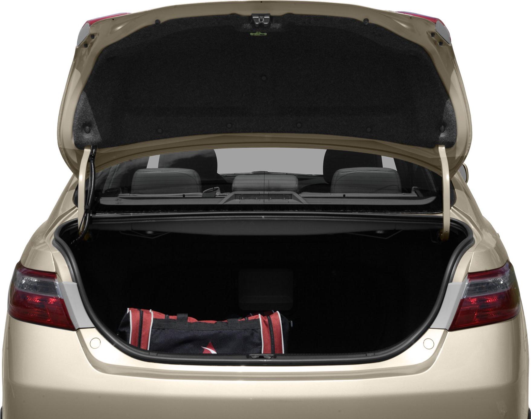Open trunk with spacious rear compartment and storage area in a sedan.