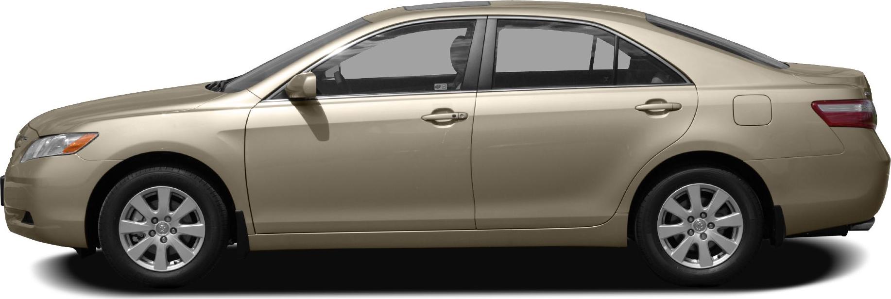 Sedan side profile with alloy wheels and beige paint