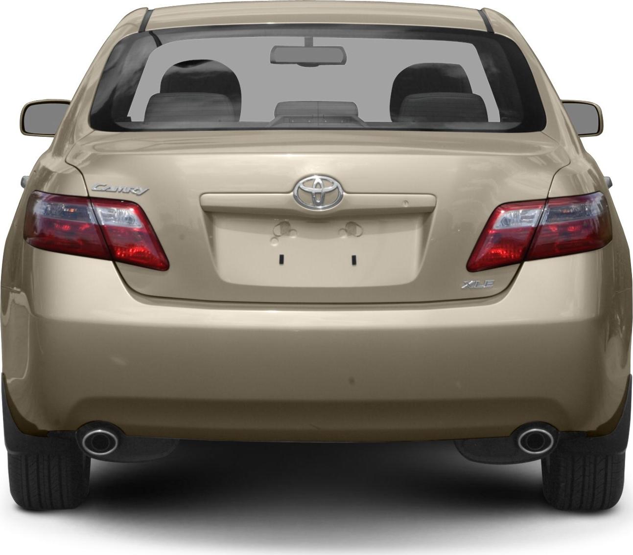 Rear view with dual exhaust pipes and distinctive tail lights