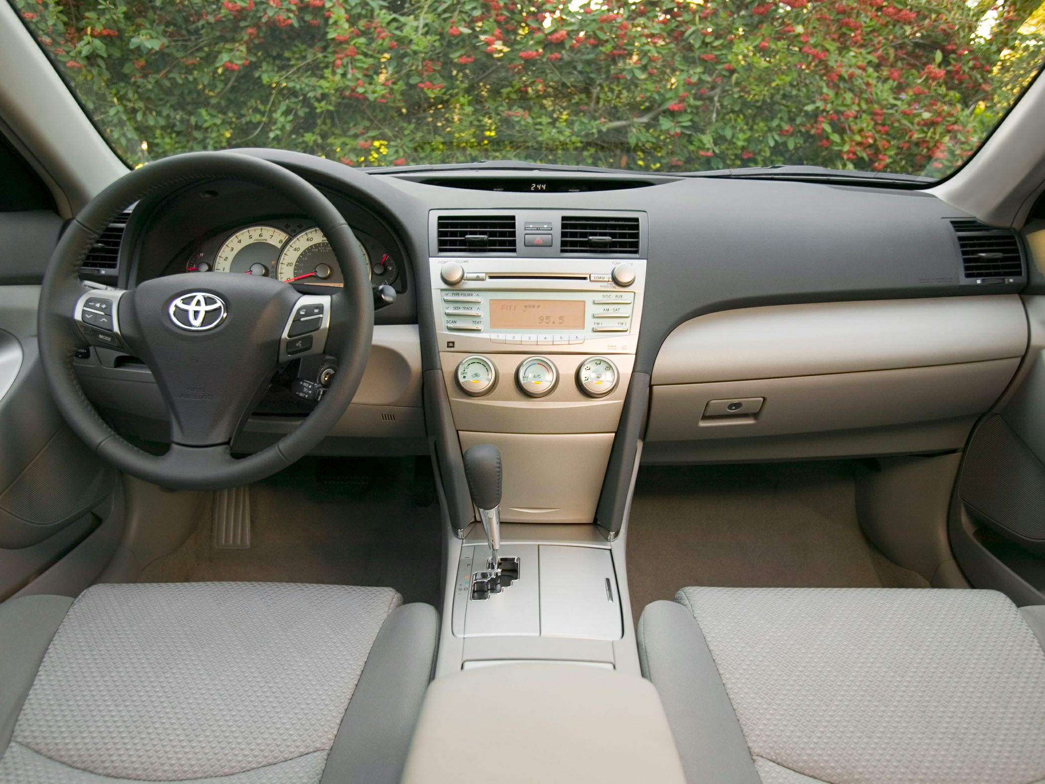 Steering wheel, dashboard, and center console with controls