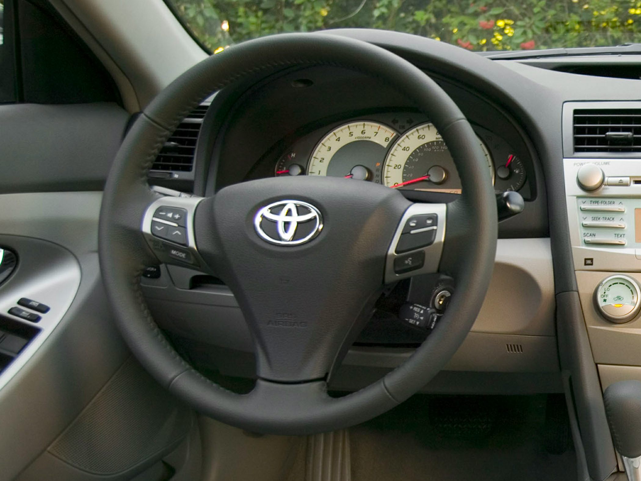 Leather-wrapped steering wheel and dashboard with instrument cluster
