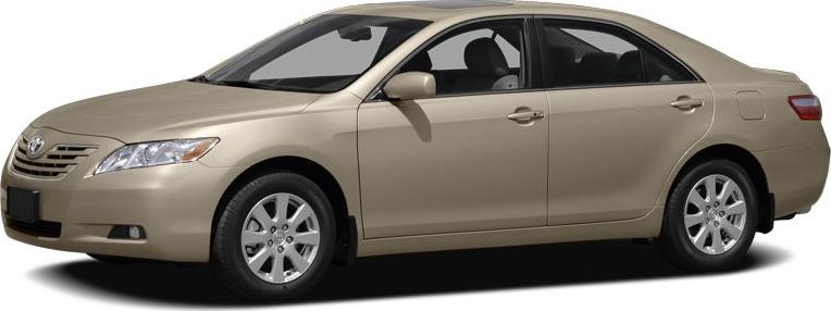 Side profile of a beige midsize sedan with alloy wheels