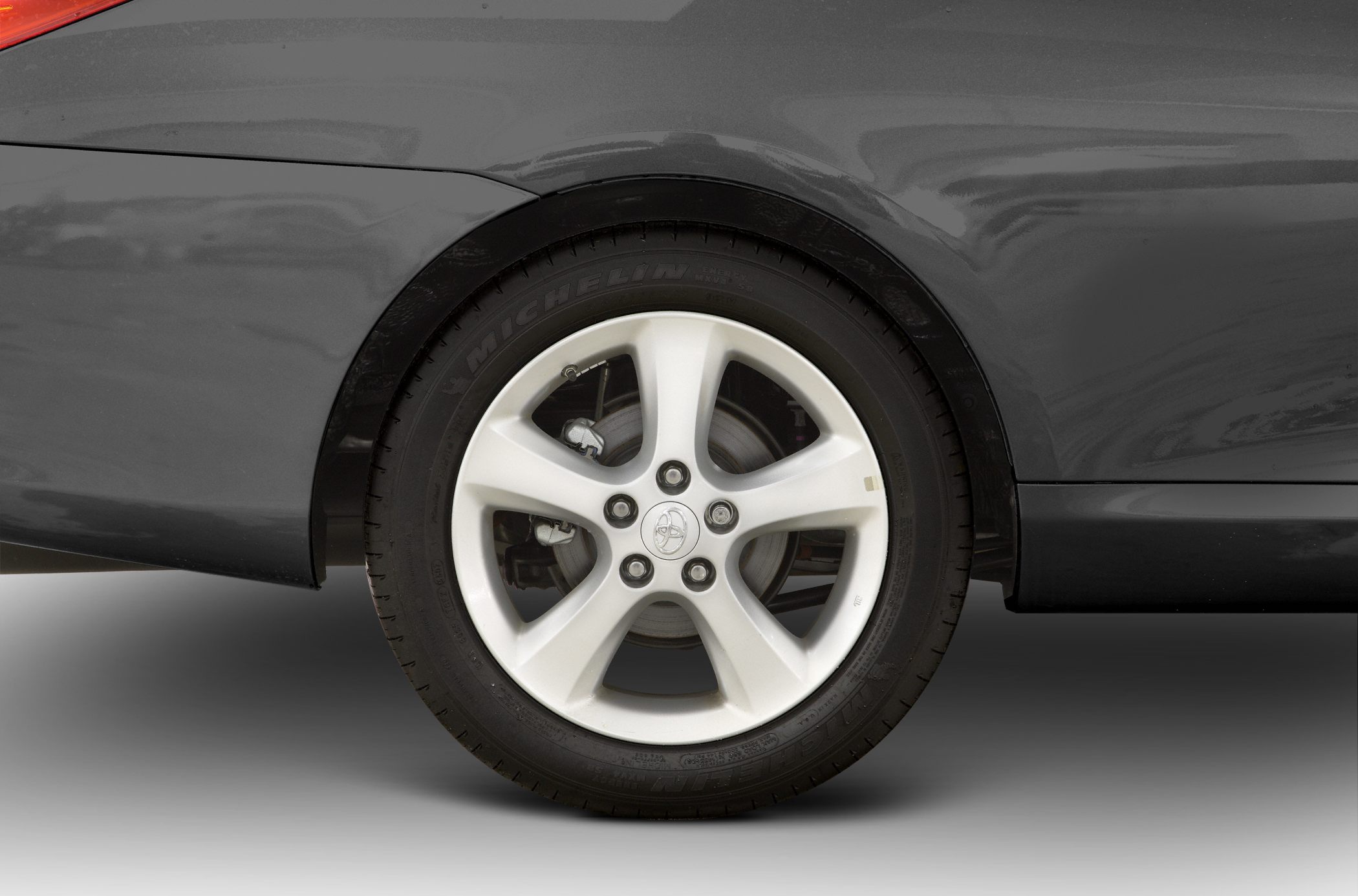 Alloy wheel and tire close-up with visible brake disc