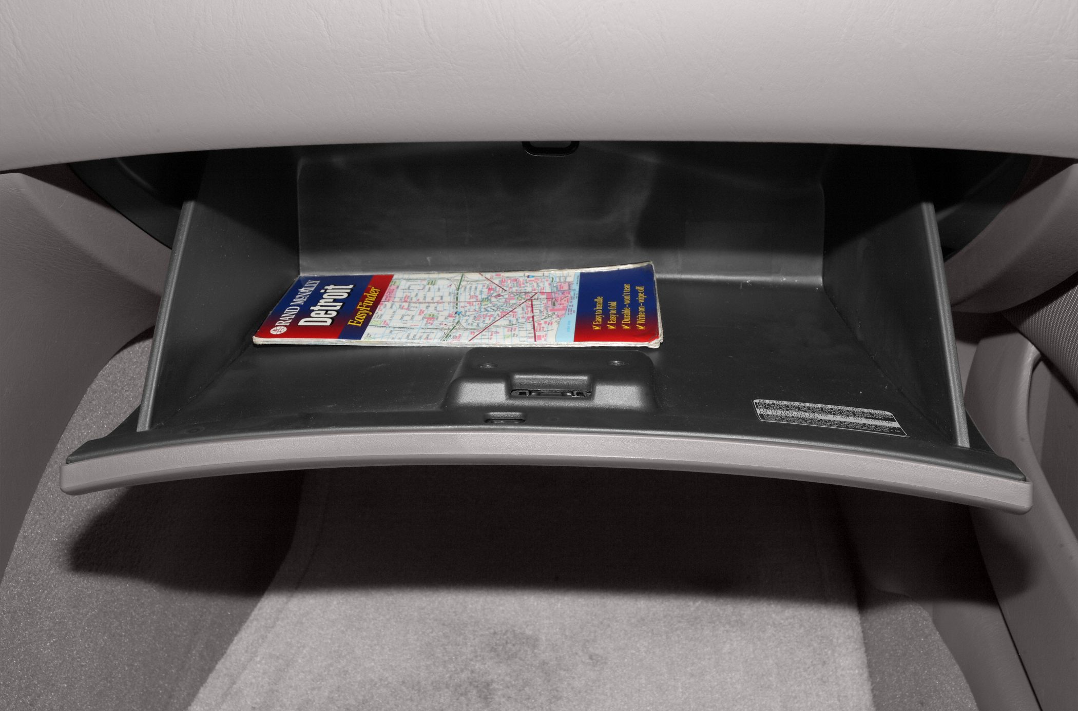 Open glove compartment with a map inside