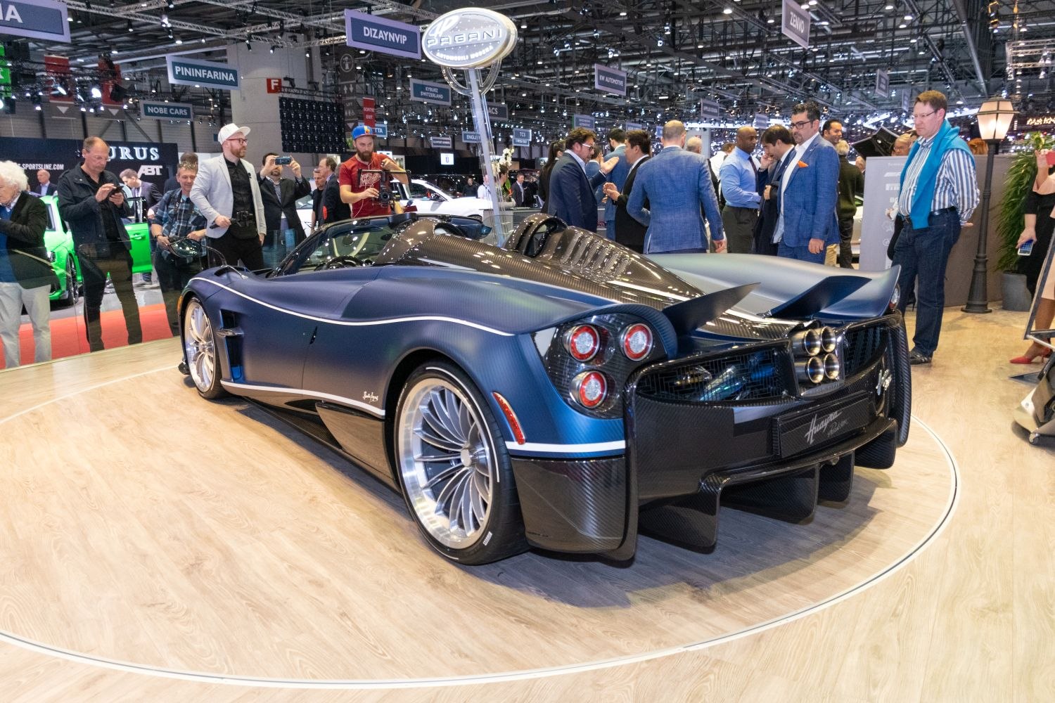 Rear view of supercar with quad exhaust and carbon fiber body