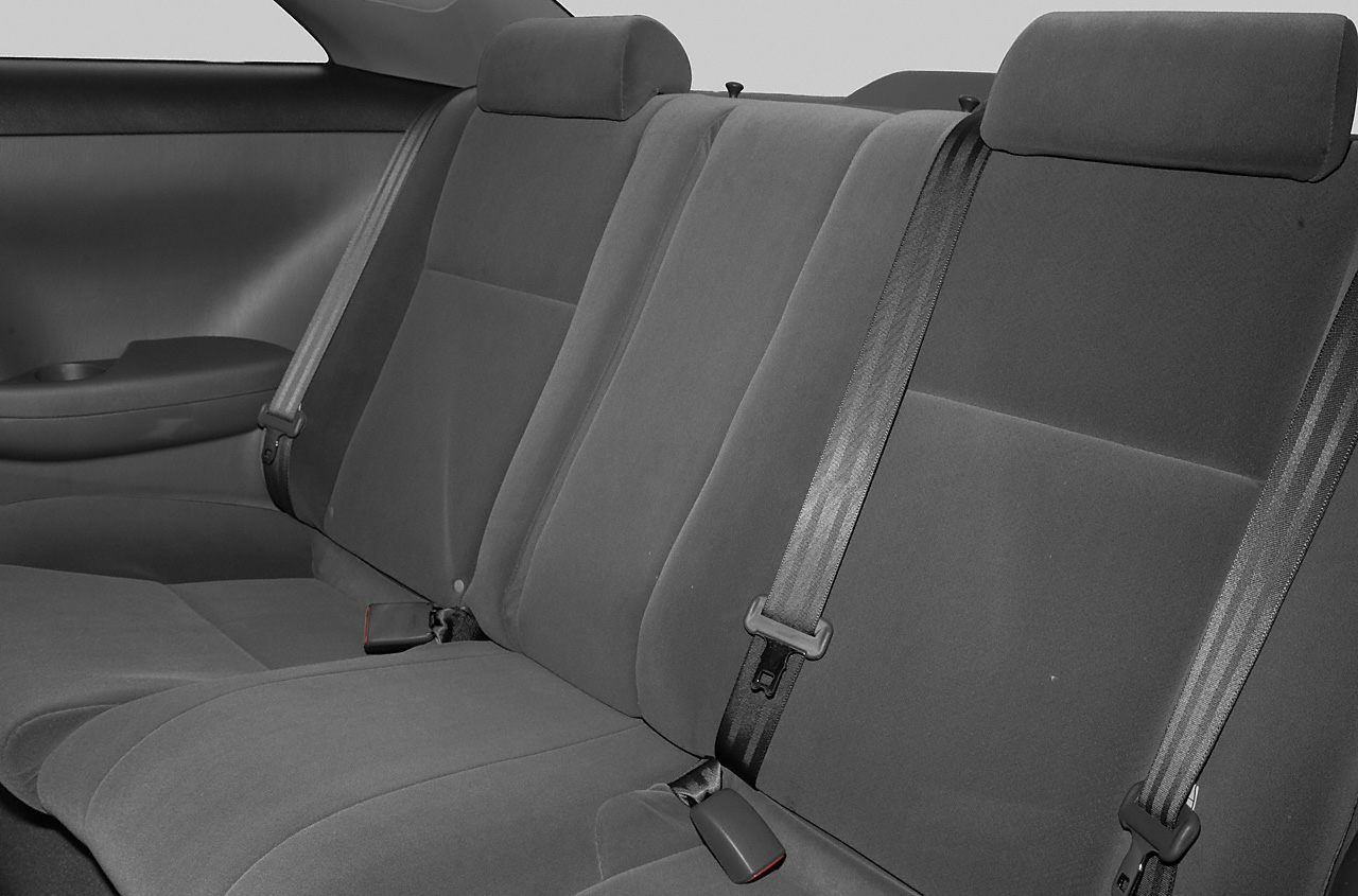Rear seats with upholstery, seat belts, and headrests