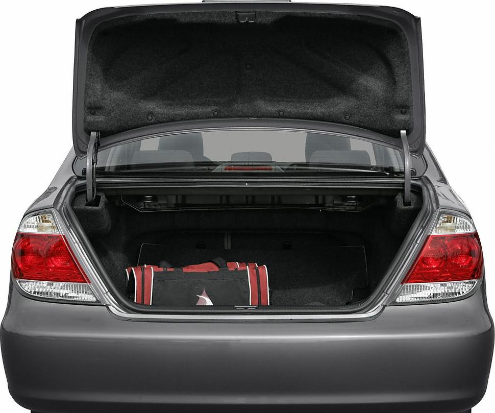 Open rear trunk with bag inside and tail lights visible