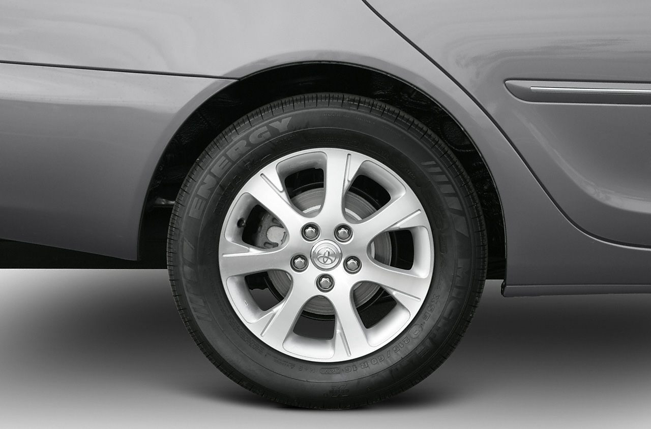 Rear alloy wheel and quarter panel detail on a sedan.