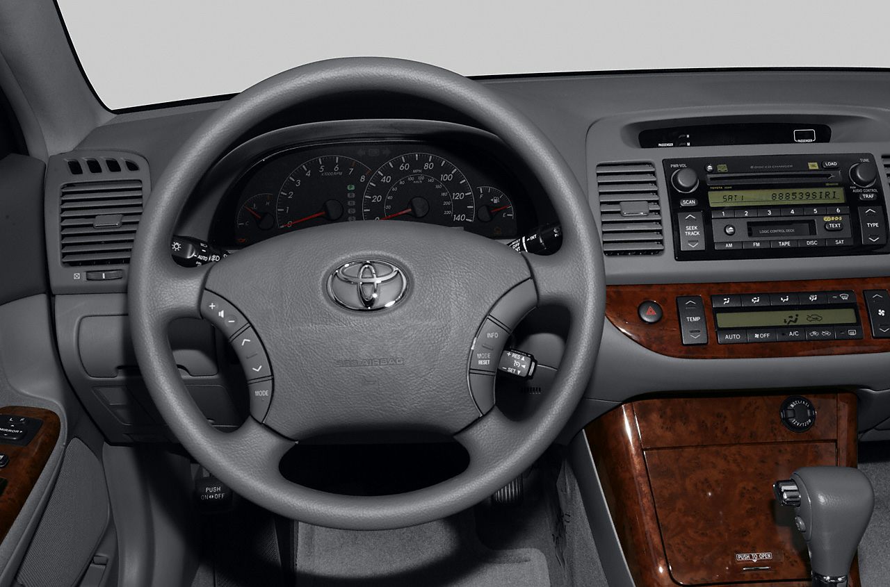 Steering wheel, instrument cluster, and center console with wood trim
