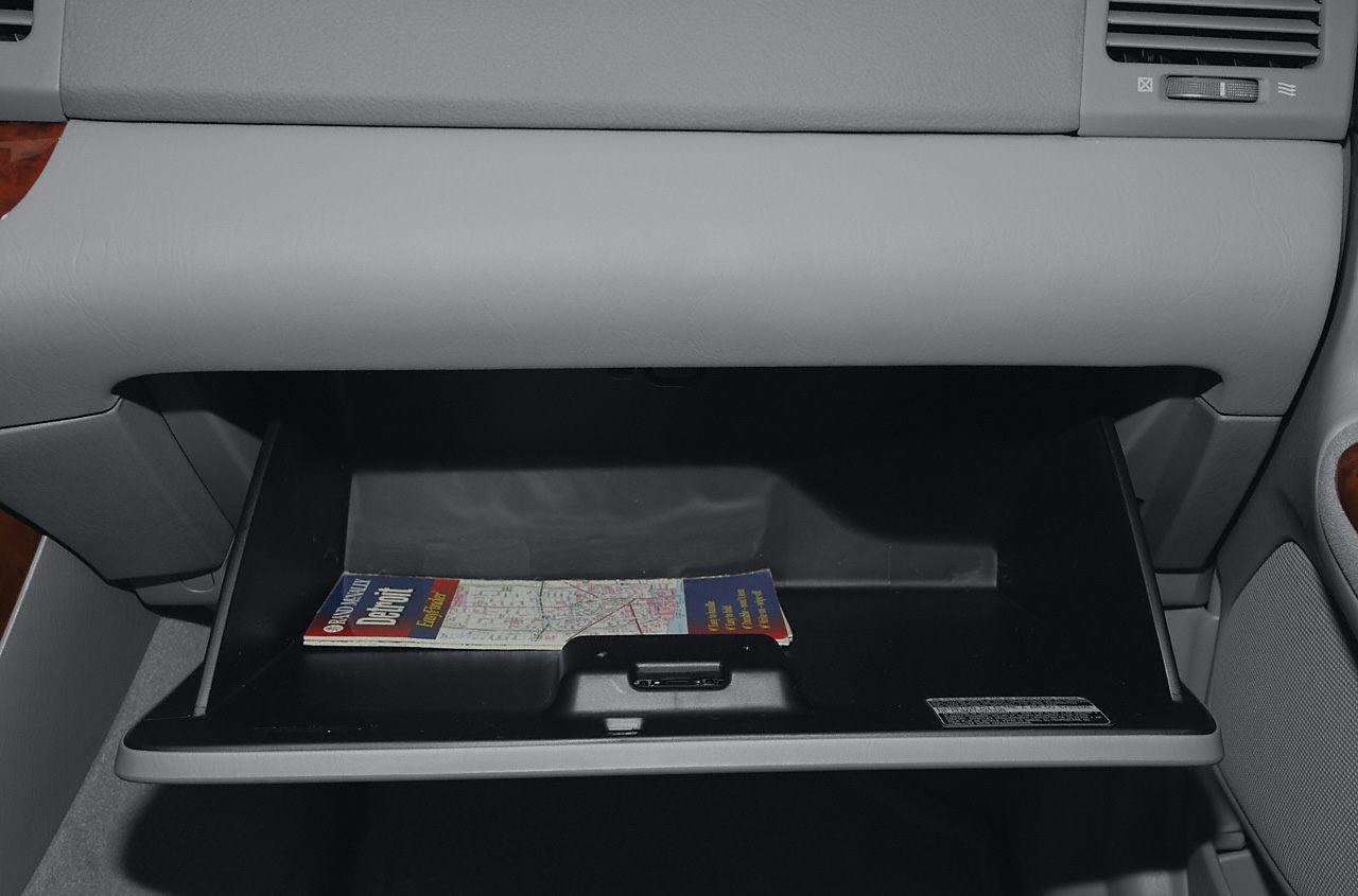Open glove compartment with a map inside
