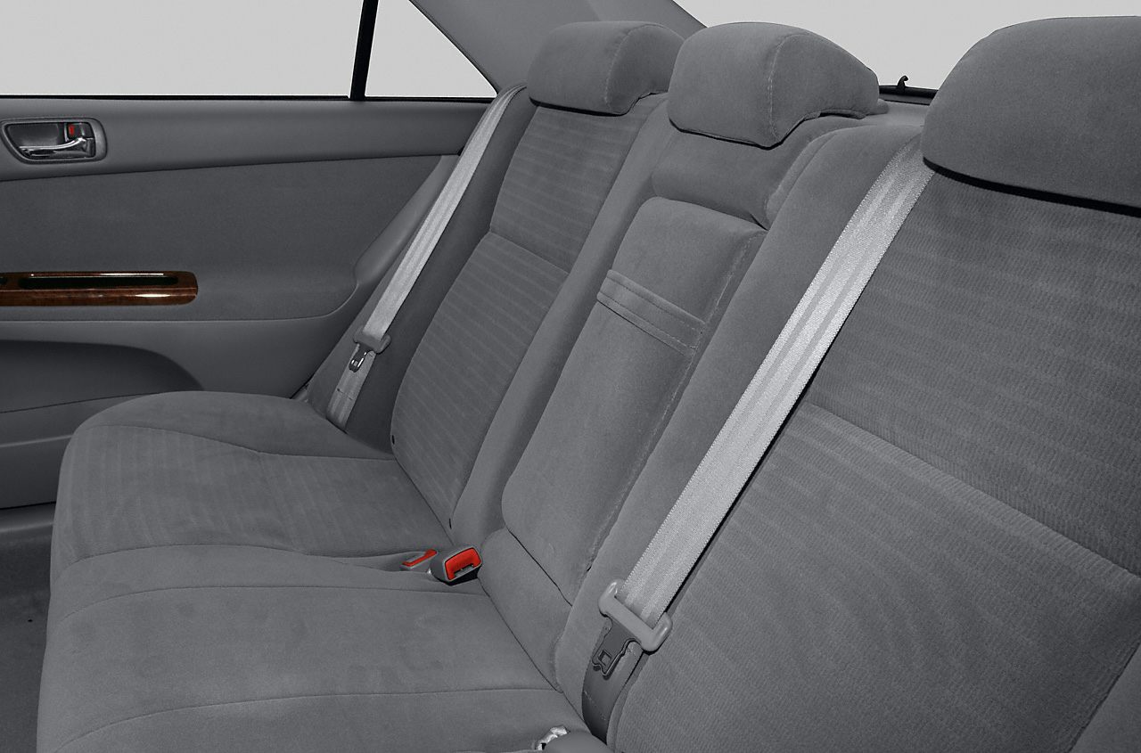 Rear seat upholstery and seatbelt details with headrests