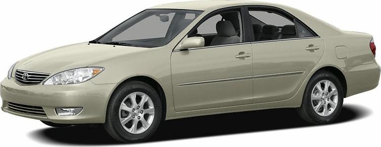 Side view of beige sedan with alloy wheels and four doors